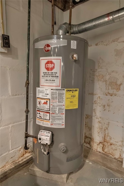 utility room with gas water heater