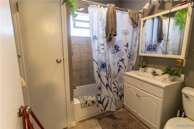 full bathroom featuring shower / tub combo with curtain, vanity, tile patterned flooring, and toilet