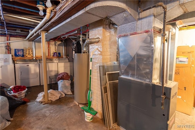 basement with separate washer and dryer, heating unit, and water heater