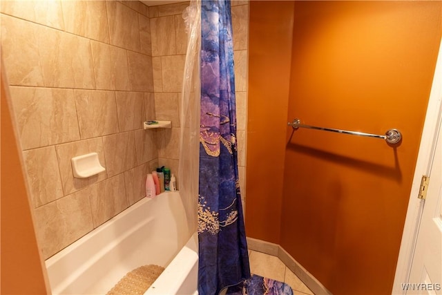 bathroom featuring tile patterned floors and shower / bath combo with shower curtain