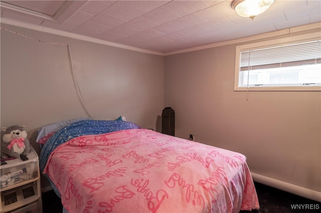 bedroom with ornamental molding