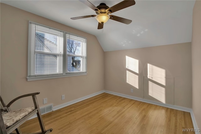 additional living space with lofted ceiling, light hardwood / wood-style floors, and ceiling fan