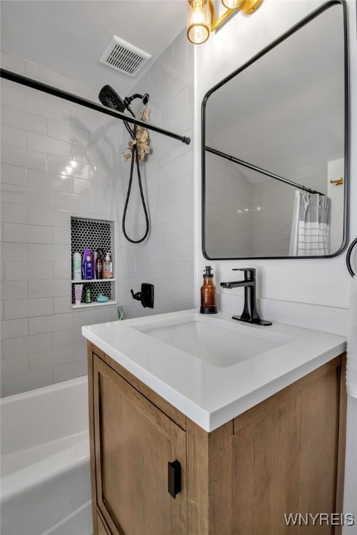 bathroom featuring vanity and shower / bath combo