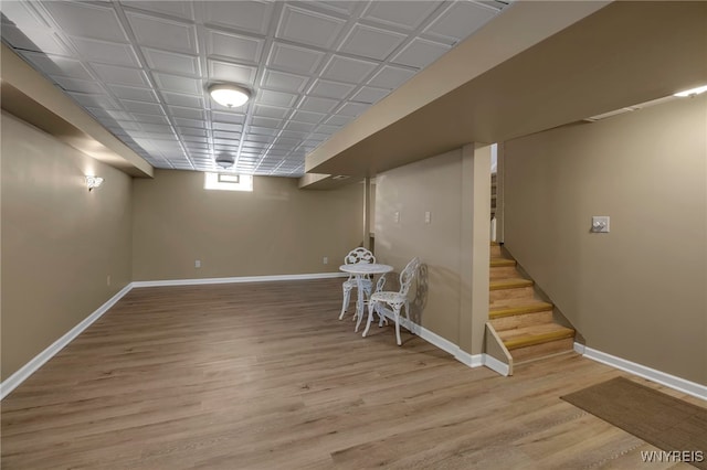 basement featuring hardwood / wood-style floors