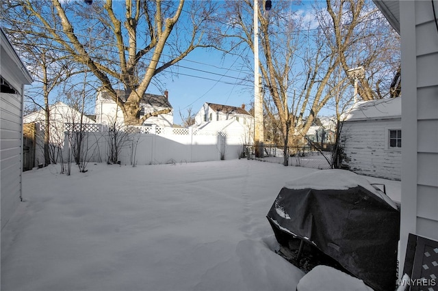 view of yard layered in snow