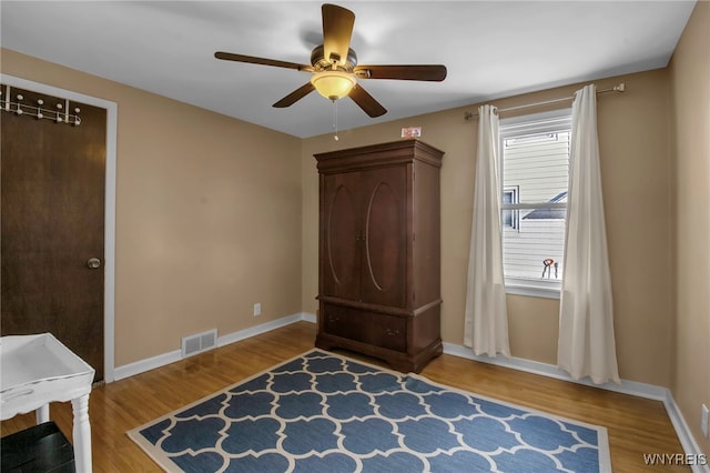 unfurnished bedroom with hardwood / wood-style flooring and ceiling fan