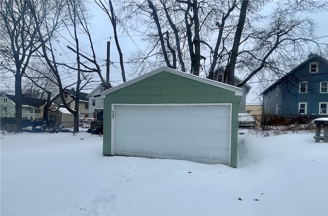 view of snow covered garage