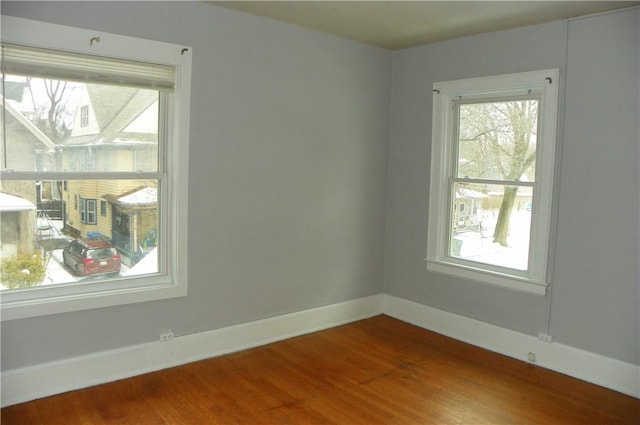 spare room featuring hardwood / wood-style floors