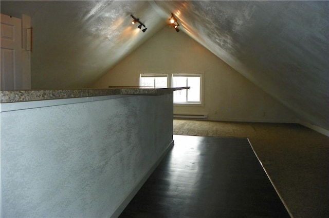 bonus room featuring baseboard heating and vaulted ceiling