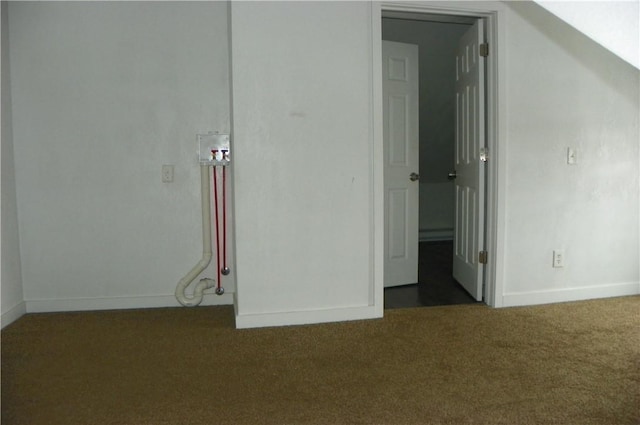 unfurnished bedroom featuring dark colored carpet