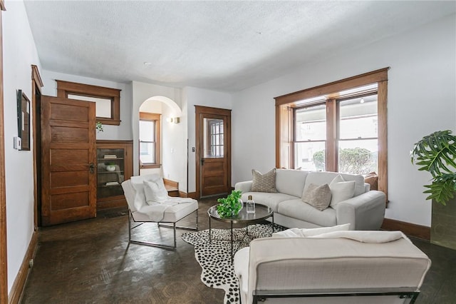 living room with a textured ceiling