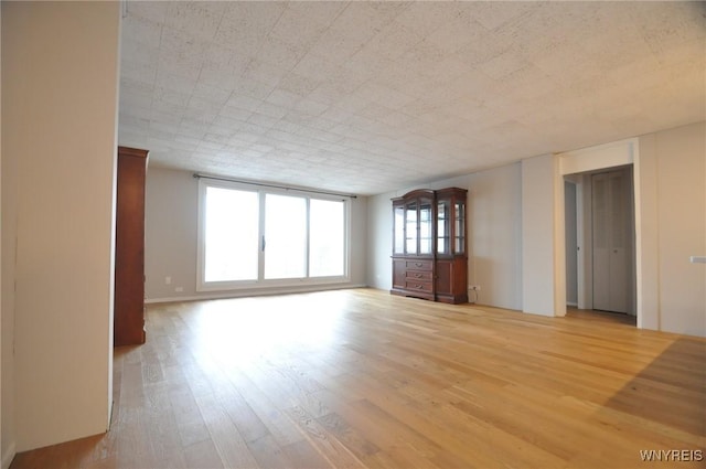 empty room with hardwood / wood-style floors