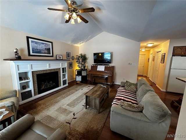 living room featuring lofted ceiling, dark hardwood / wood-style flooring, and ceiling fan