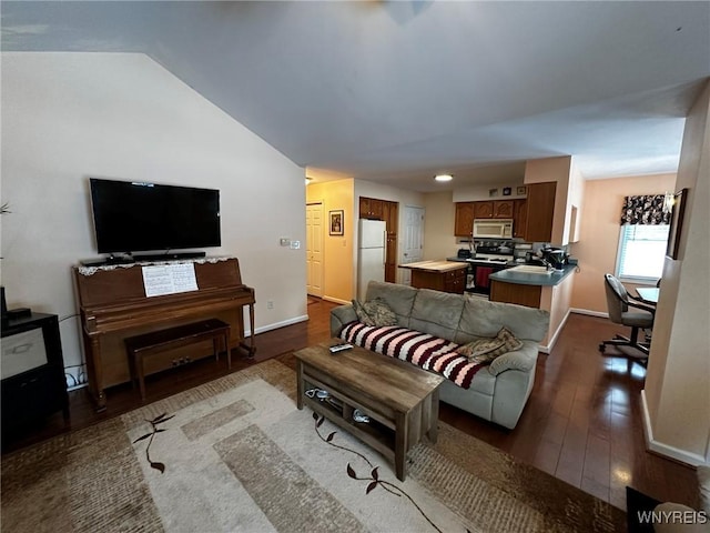 living room with lofted ceiling and light hardwood / wood-style floors