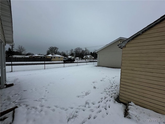 view of yard layered in snow