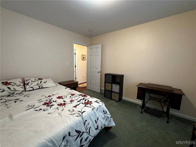 bedroom with dark colored carpet