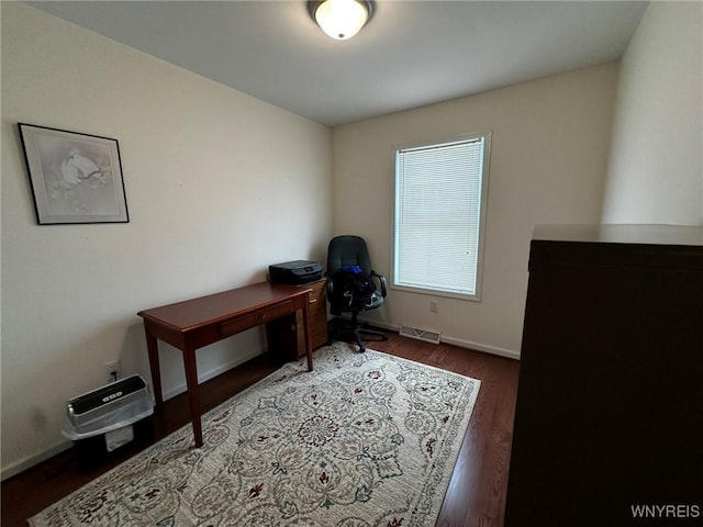 office with dark wood-type flooring