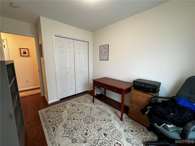 office space with dark hardwood / wood-style floors