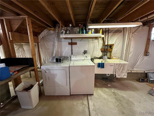 laundry area with sink and washer and dryer