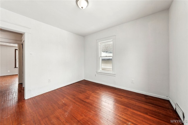 spare room featuring dark hardwood / wood-style flooring