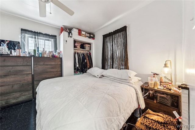 bedroom featuring ceiling fan and a closet