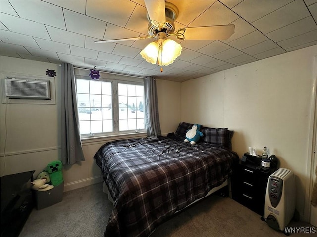 carpeted bedroom featuring ceiling fan and a wall mounted air conditioner