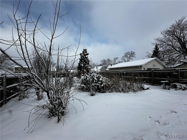 view of yard covered in snow