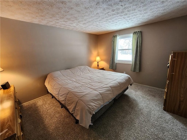 bedroom with carpet and a textured ceiling