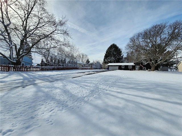 view of yard layered in snow