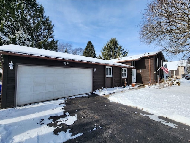 ranch-style house featuring a garage