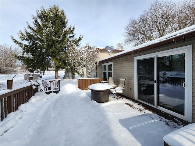 view of snow covered deck