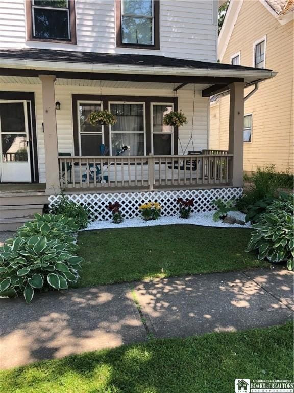 property entrance featuring covered porch