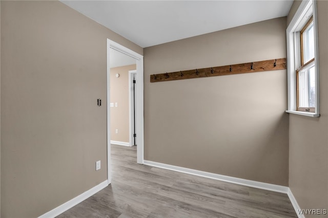 spare room featuring light wood-type flooring