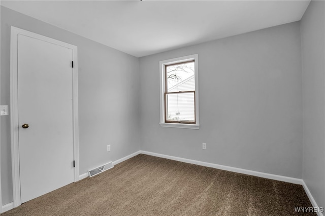 empty room with carpet flooring