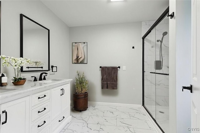 bathroom with vanity and a shower with shower door