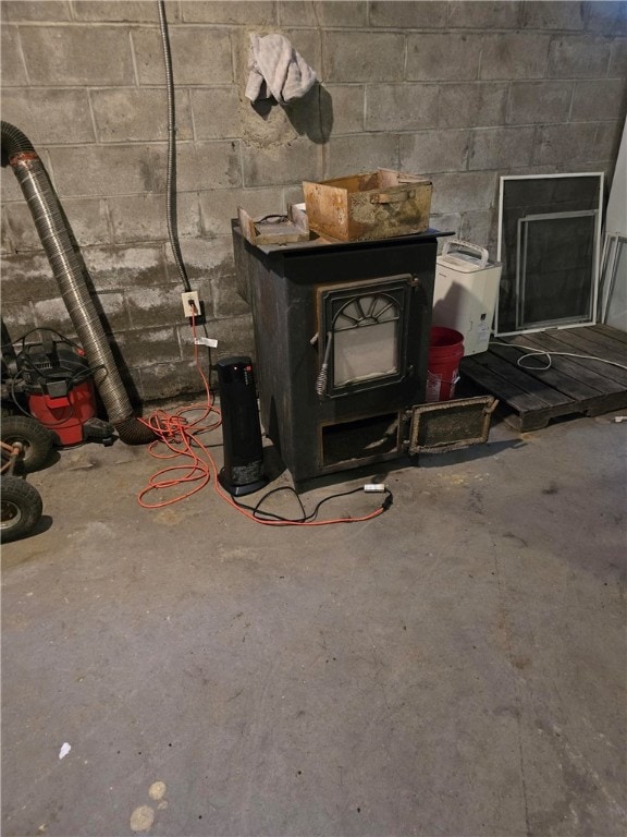 room details with a wood stove and concrete floors