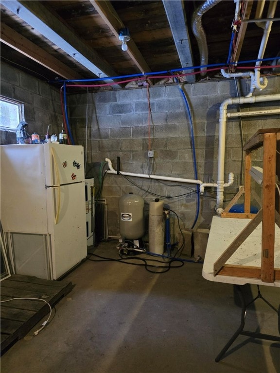 basement with white fridge