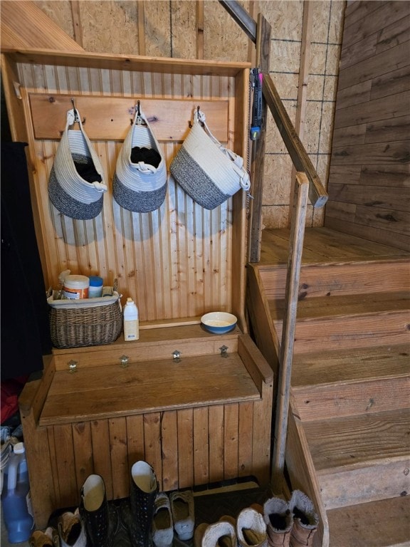 mudroom with wooden walls