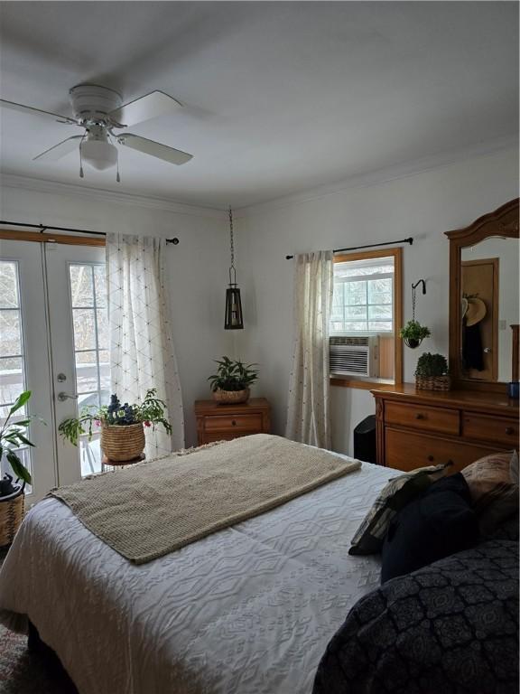 bedroom with cooling unit, crown molding, and ceiling fan