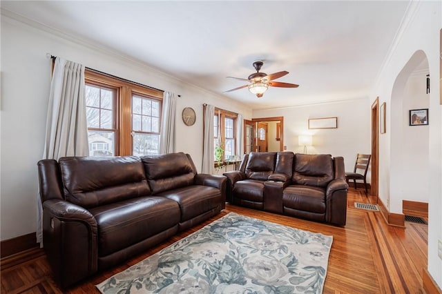 living room featuring crown molding, ceiling fan, and hardwood / wood-style flooring