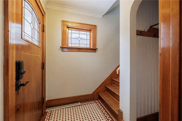 foyer featuring ornamental molding