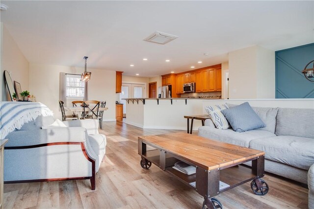 living room with light hardwood / wood-style floors