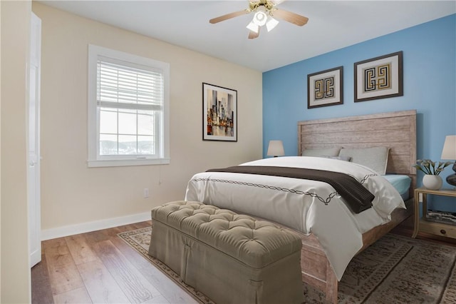 bedroom featuring ceiling fan and light wood-type flooring