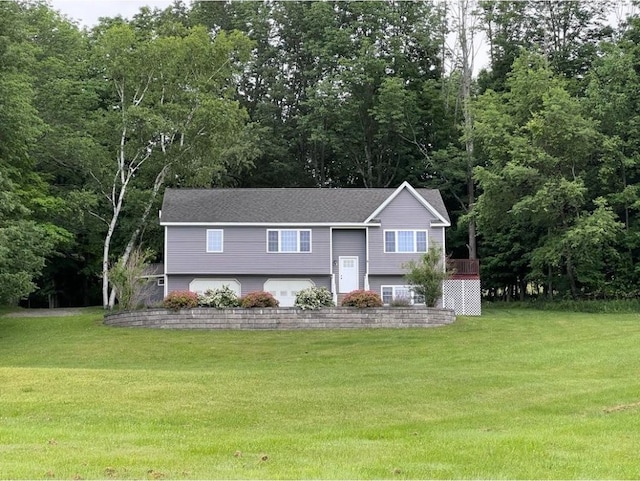 bi-level home with a front lawn