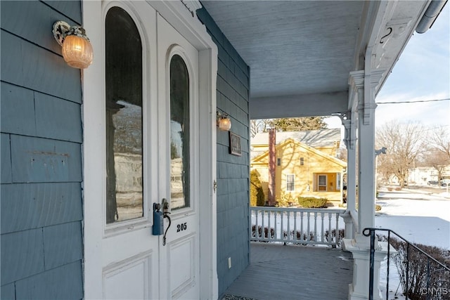 view of snow covered property entrance