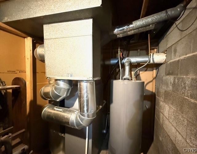 utility room featuring gas water heater