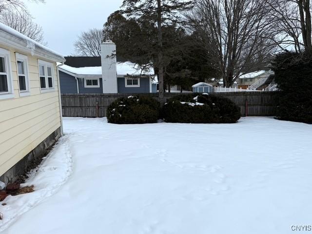 view of yard covered in snow