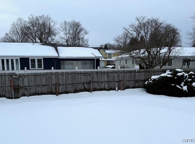 view of yard layered in snow