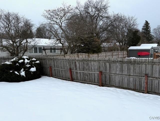 view of yard covered in snow