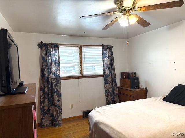 bedroom featuring ceiling fan and light wood-type flooring